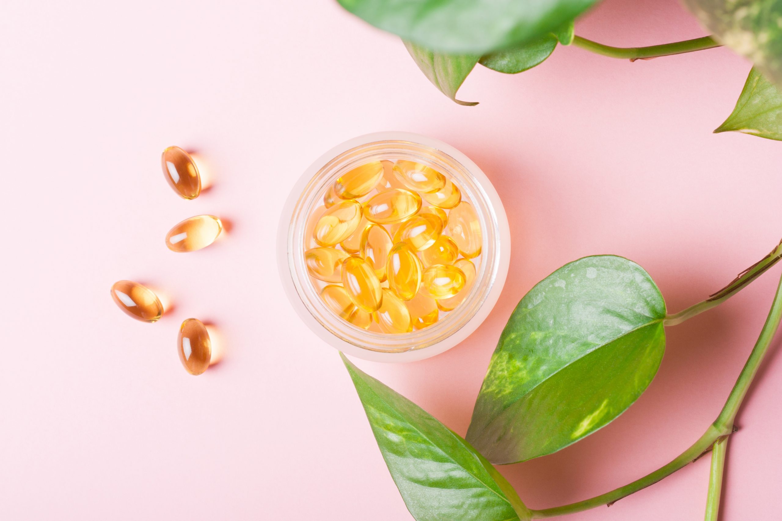 Fish Oil Capsules (omega 3) On A Pink Background