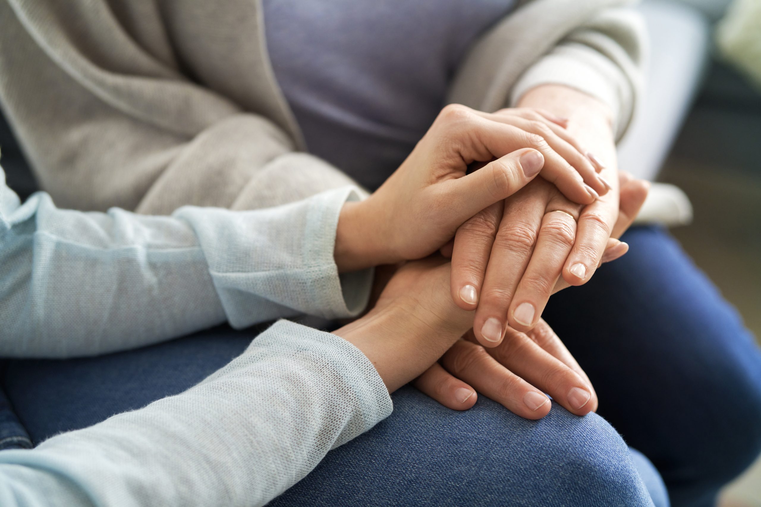 Close Up Of Holding Hands In A Sign Of Support